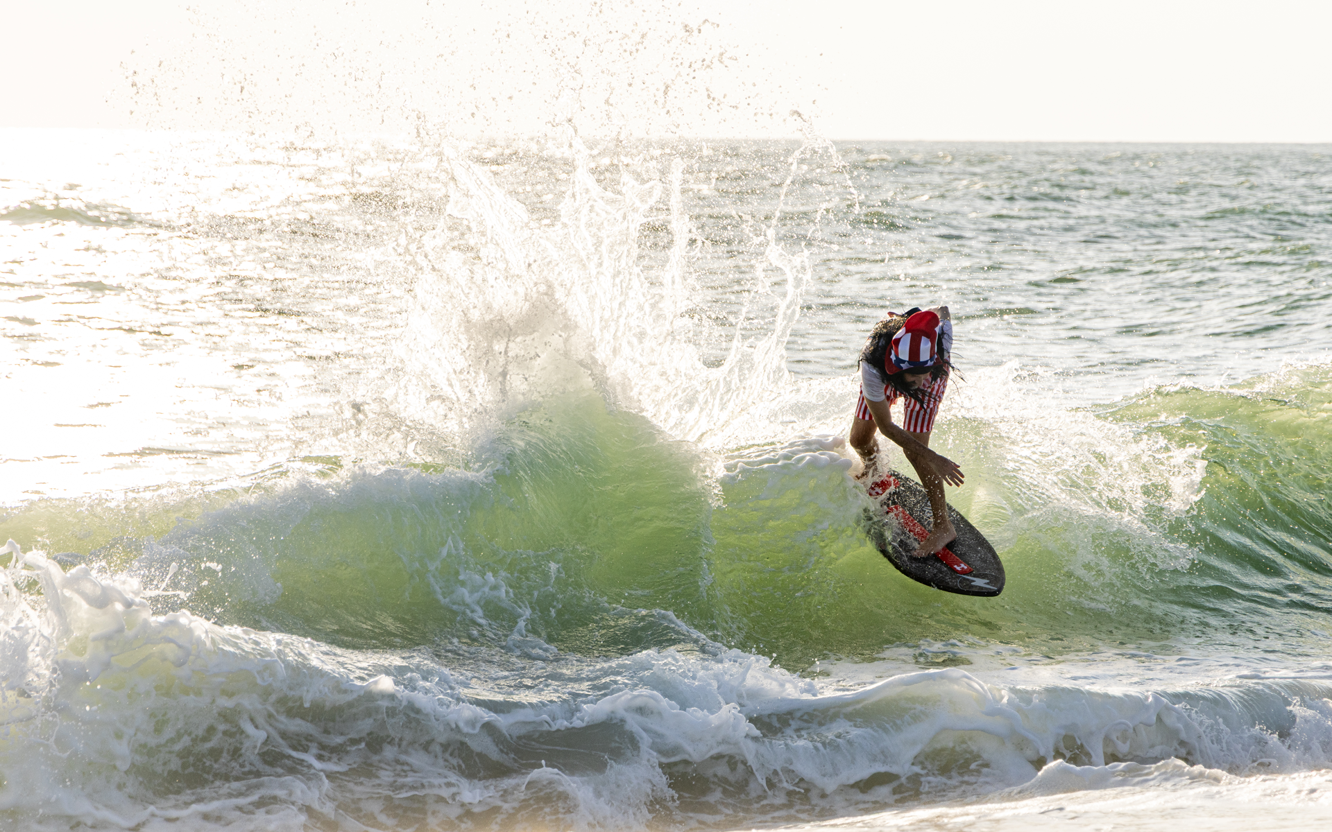 Zap Fuse-X USA LTD skimboard in surf action